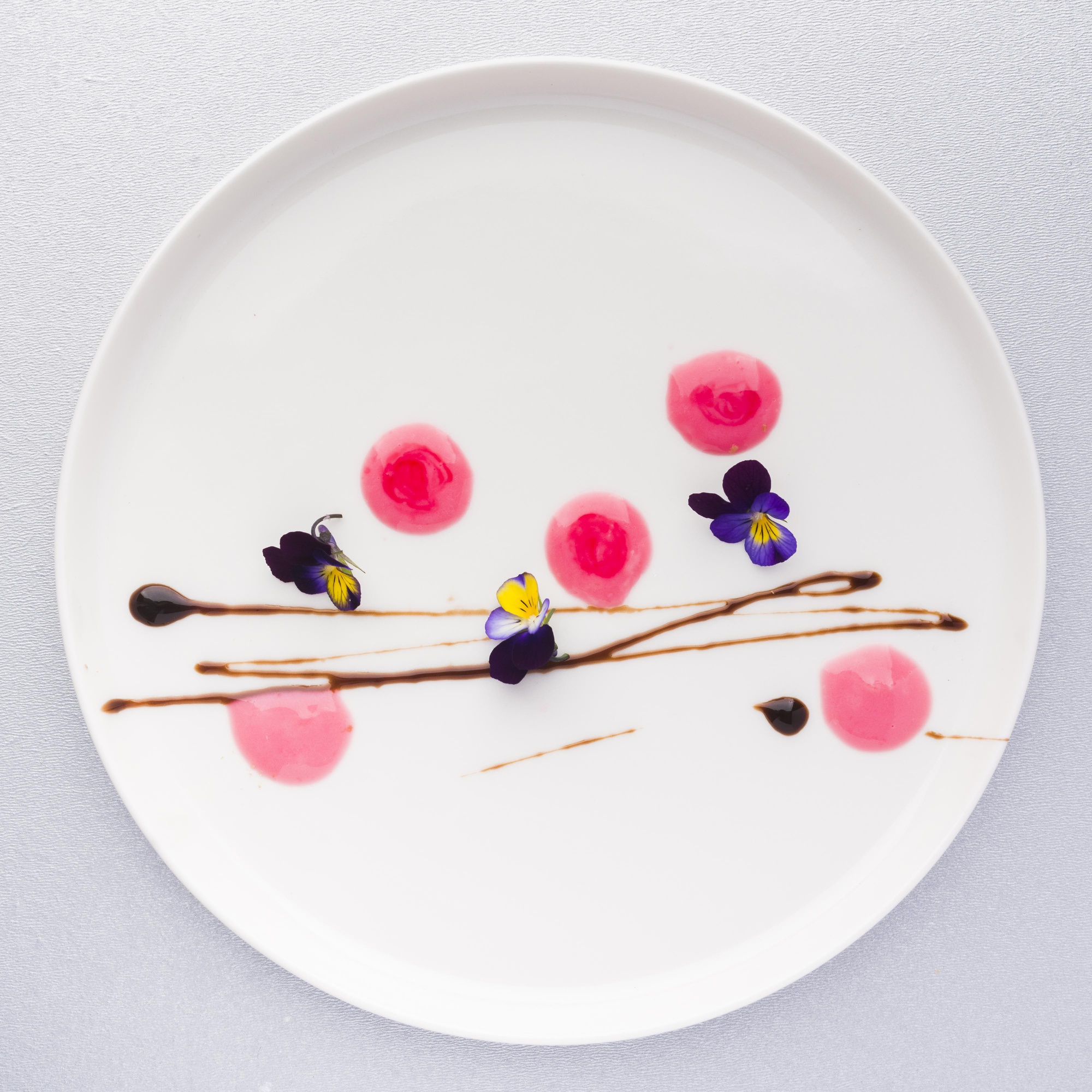 plated modern dish with geometric garnish